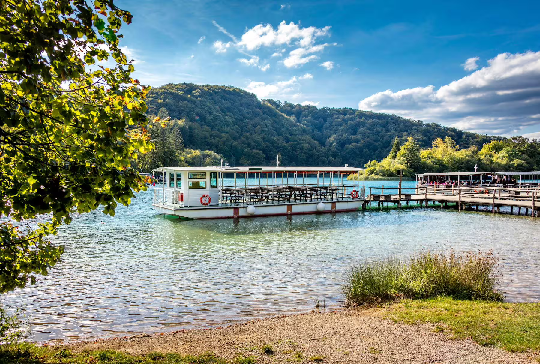 Electric boat cruise on Plitvice Lakes from Zadar and Biograd day trip, turquoise water and forested hills