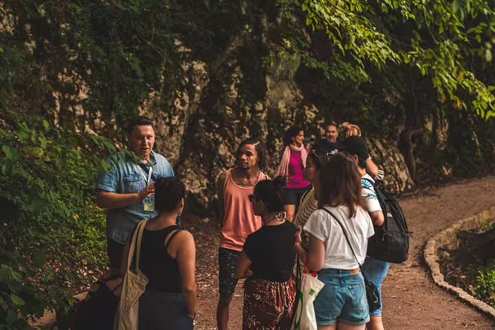 Guide briefing a small group on a forest trail during a scheduled Plitvice Lakes guided tour