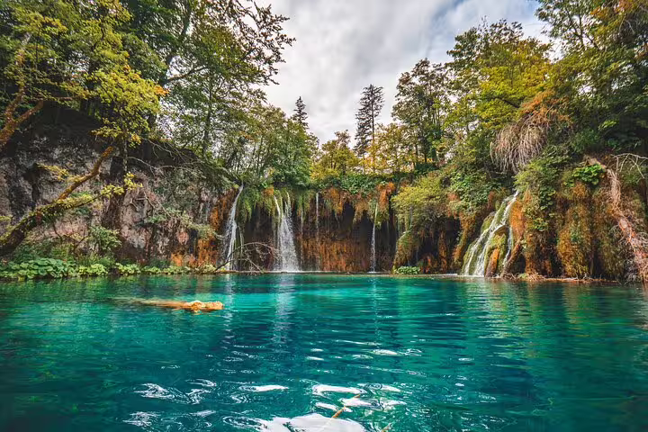 Guided Plitvice Lakes tour view of turquoise lake and cascading waterfalls in Plitvice Lakes National Park