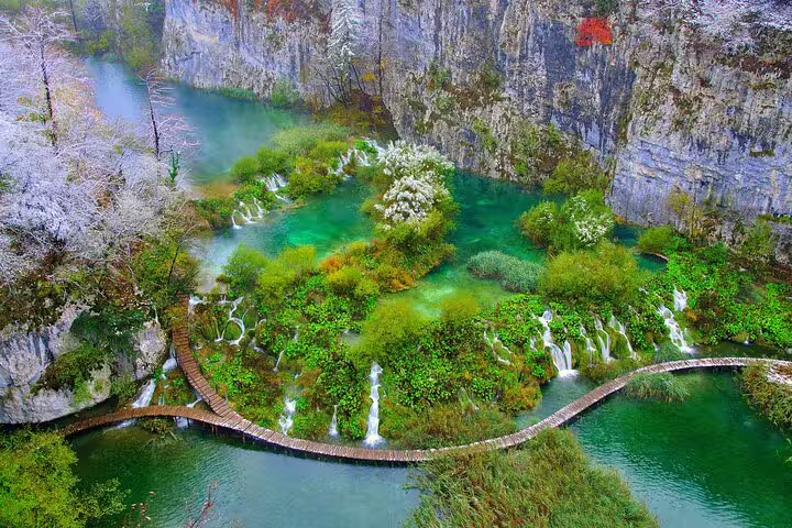 Plitvice Lakes National Park admission ticket aerial view of emerald lakes, cascades, and wooden walkways