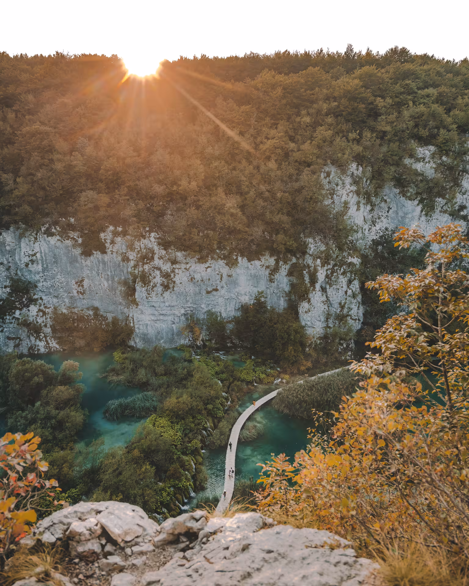 Sunset over Plitvice Lakes boardwalk and emerald pools, hidden gems tour from Zagreb with scenic viewpoints