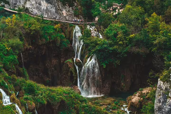 Waterfall and boardwalk viewpoint at Plitvice Lakes National Park on a private guided day tour in Croatia