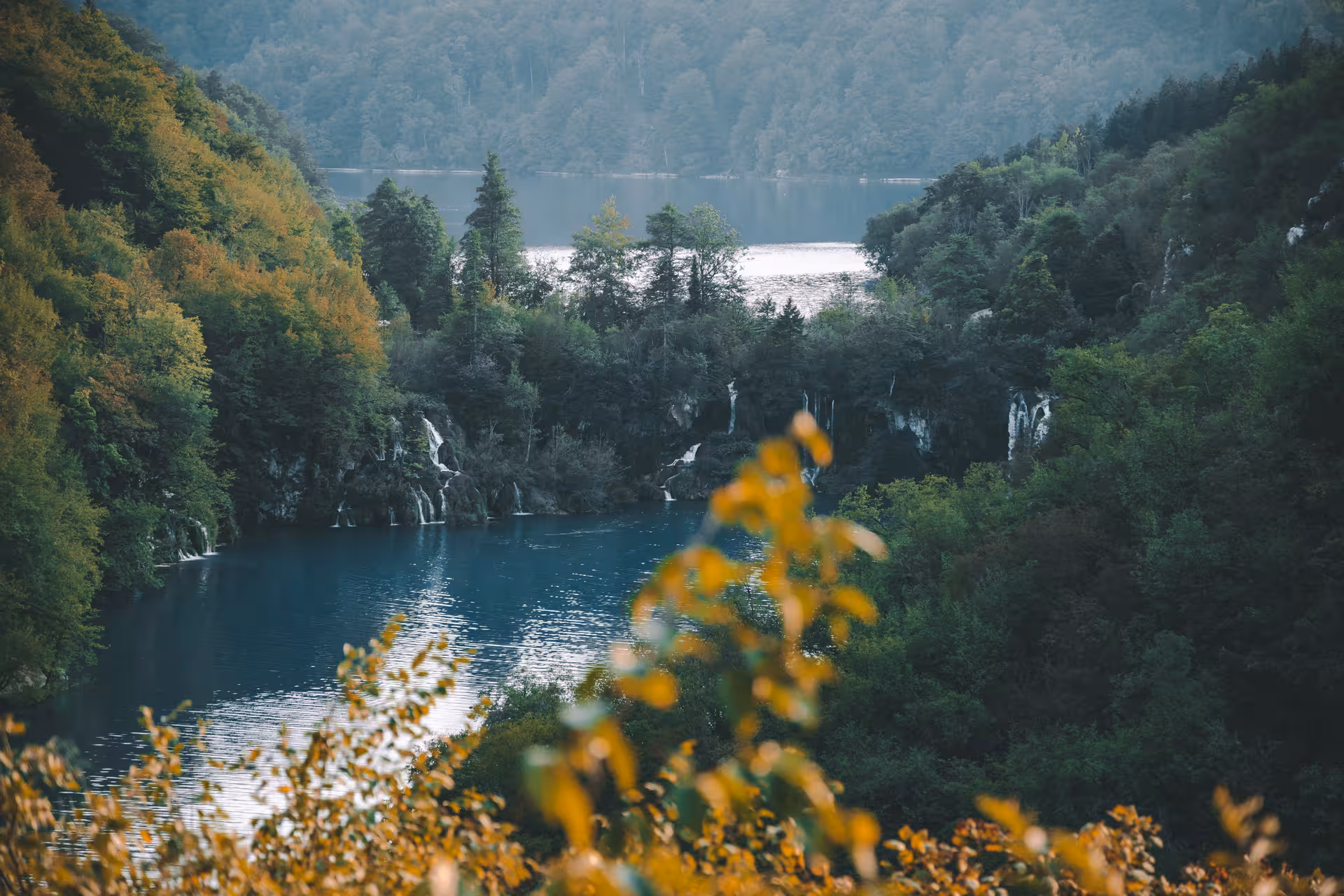 Panoramic Plitvice Lakes viewpoint with waterfalls and forest, hidden gems day tour from Zagreb, Croatia