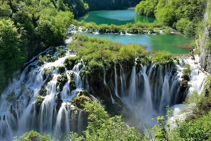 Panoramic waterfalls and turquoise lakes at Plitvice Lakes National Park on a private tour from Split, Croatia
