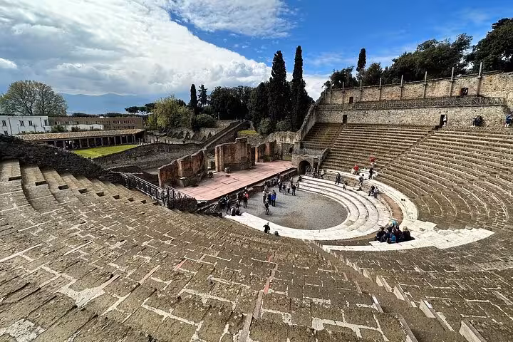 Explore the ancient amphitheater in Pompeii on a guided tour with tickets and lunch from Sorrento.