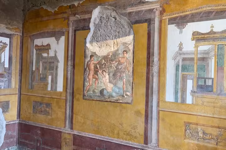 Discover vibrant frescoes in a preserved Pompeii villa, showcasing ancient Roman art on a guided small group tour.