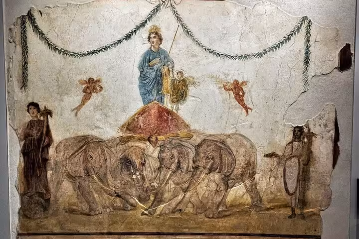 Discover detailed Pompeii frescoes showcasing historical art on a skip-the-line guided tour from Naples.