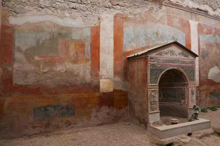 Ancient frescoes and intricate mosaics at Pompeii showcasing Roman art on a skip-the-line tour with Vesuvius lunch.