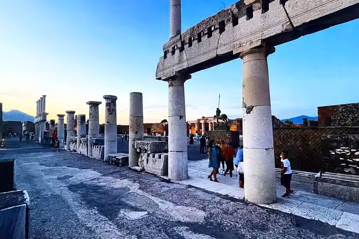 Experience a guided tour of Pompeii's historic columns and pathways, offering insights into ancient Roman life.
