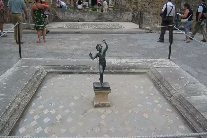 Pompeii House of the Faun dancing bronze statue, highlight of Naples to Pompeii half-day group tour visit