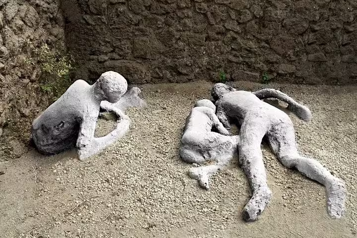 Plaster casts of victims preserved in ash at the ruins of Pompeii, a powerful stop on guided small group tours in Italy