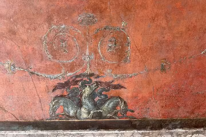 Discover intricate frescoes showcasing Roman art and mythology on a Pompeii guided tour from the Amalfi Coast.