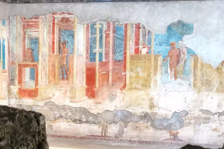 Colorful frescoes showcasing Roman life in Pompeii, a highlight of the guided tour from Amalfi Coast.