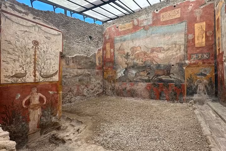 Explore Pompeii's vibrant frescoes showcasing ancient Roman life on a guided tour from Positano.