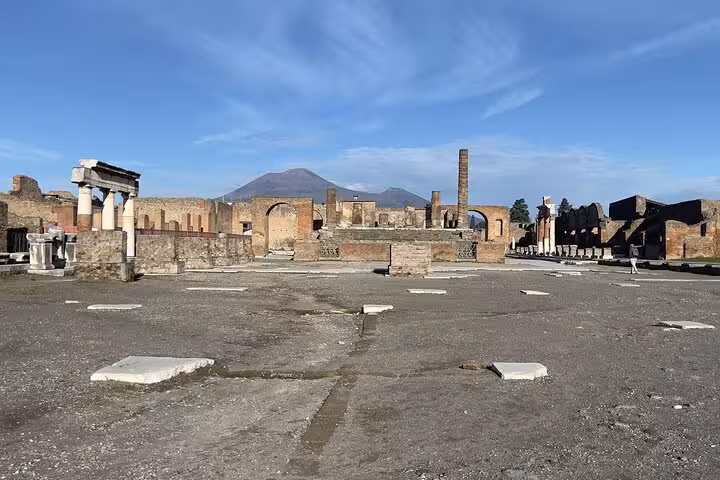 Discover the vast ruins of Pompeii with Mount Vesuvius in the background on a guided tour from Sorrento.