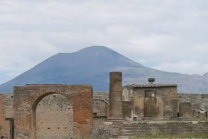 Pompeii ruins with Mount Vesuvius backdrop on VIP small-group guided tour including entrance ticket