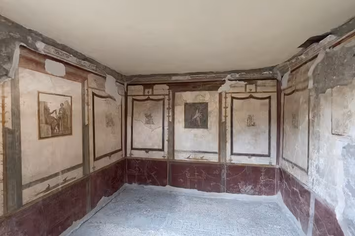 Explore the preserved frescoes of Pompeii on a small group tour from Sorrento, showcasing ancient Roman artistry.
