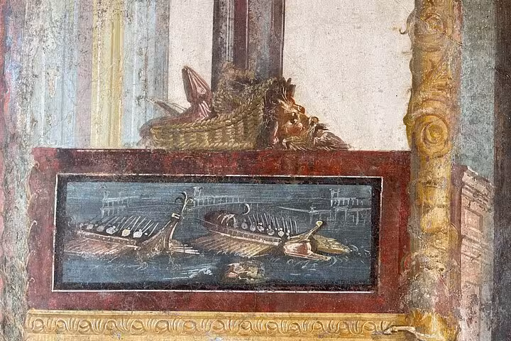 Detailed fresco depicting Roman ships and a mythical scene in Pompeii, highlighting classical art and culture.