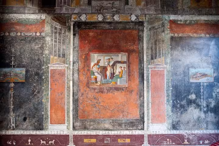 Intricate wall frescoes in Pompeii highlight Roman culture and art, a must-see on guided tours from Positano.