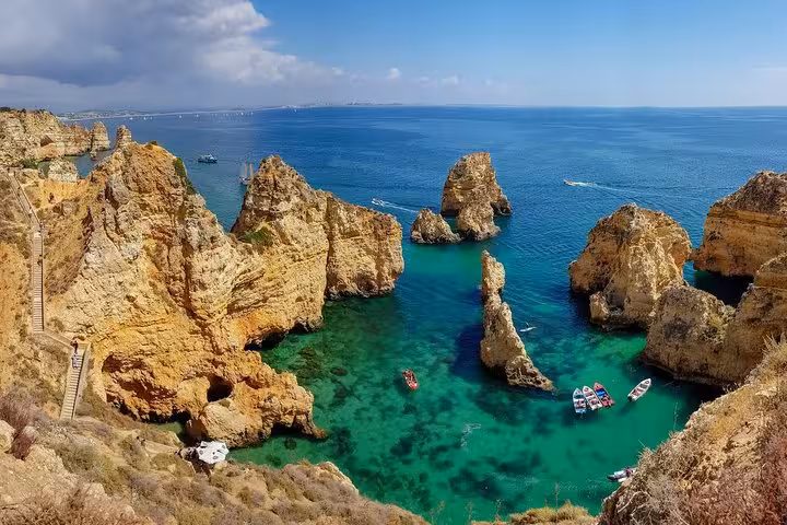 Stunning view of Ponta da Piedade's golden cliffs and turquoise waters in Algarve, perfect for a private tour adventure.