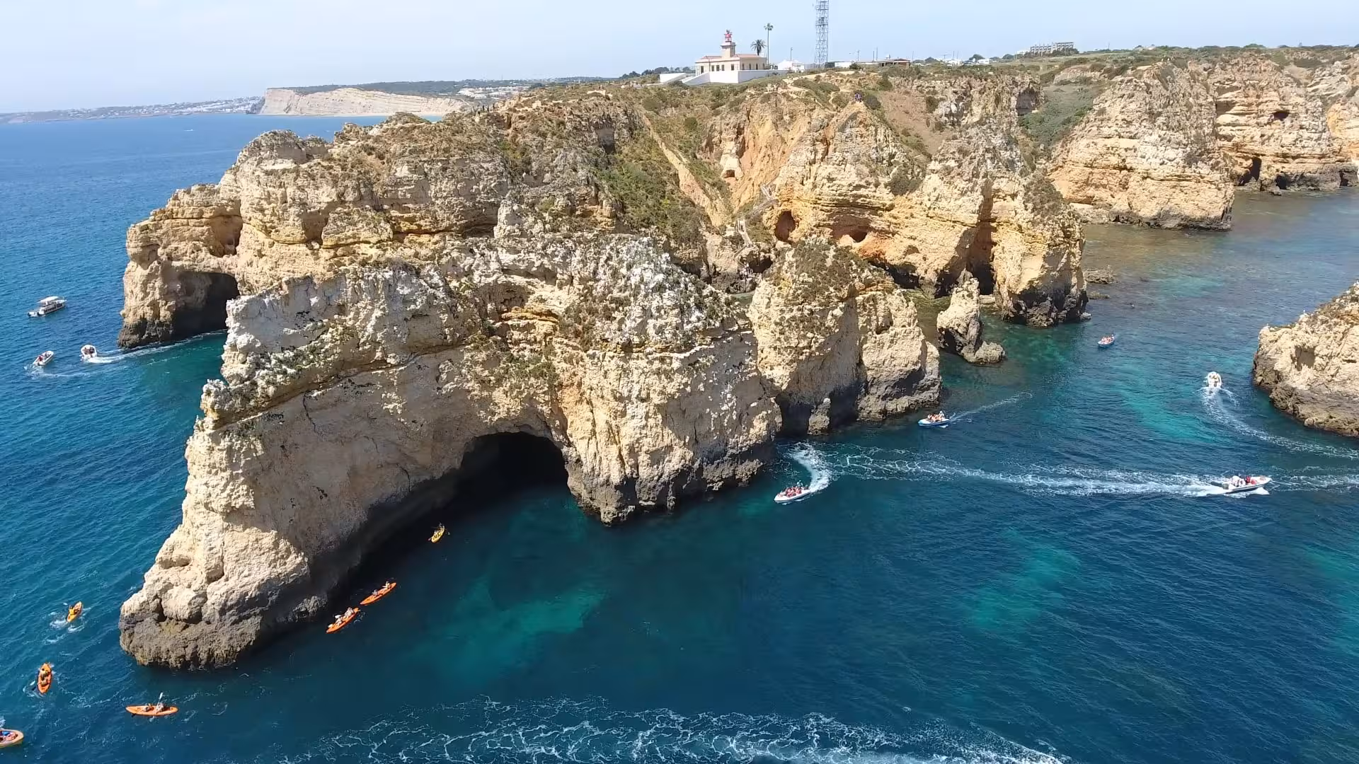Aerial view of Ponta da Piedade Lagos Algarve cliffs and grottoes with boats on 1h15 coastal cruise route