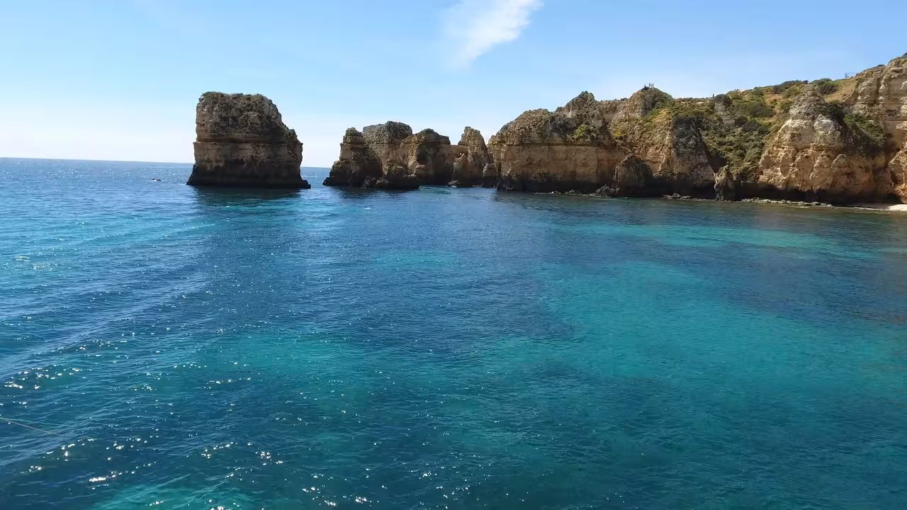 Turquoise Algarve waters and Ponta da Piedade sea stacks on Lagos 1h15 boat cruise along the cliffs