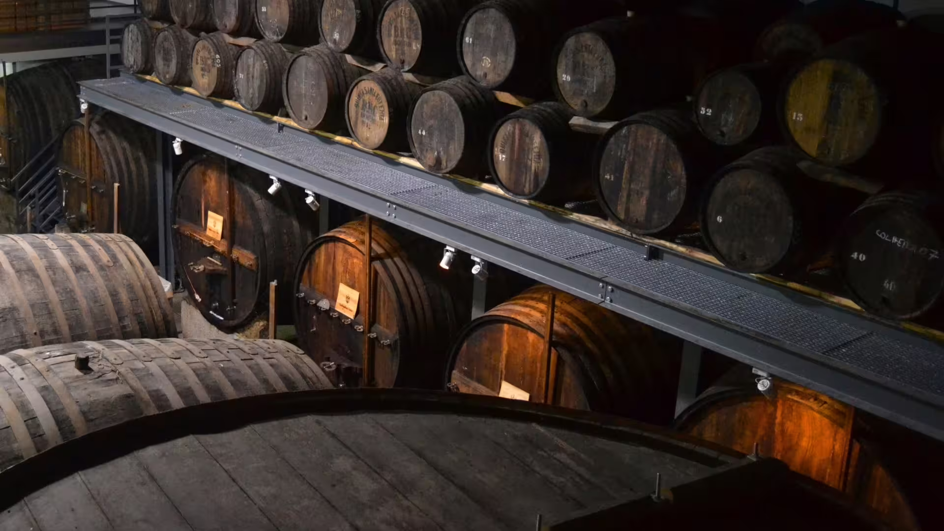 Image of different old port wine barrels at the winery