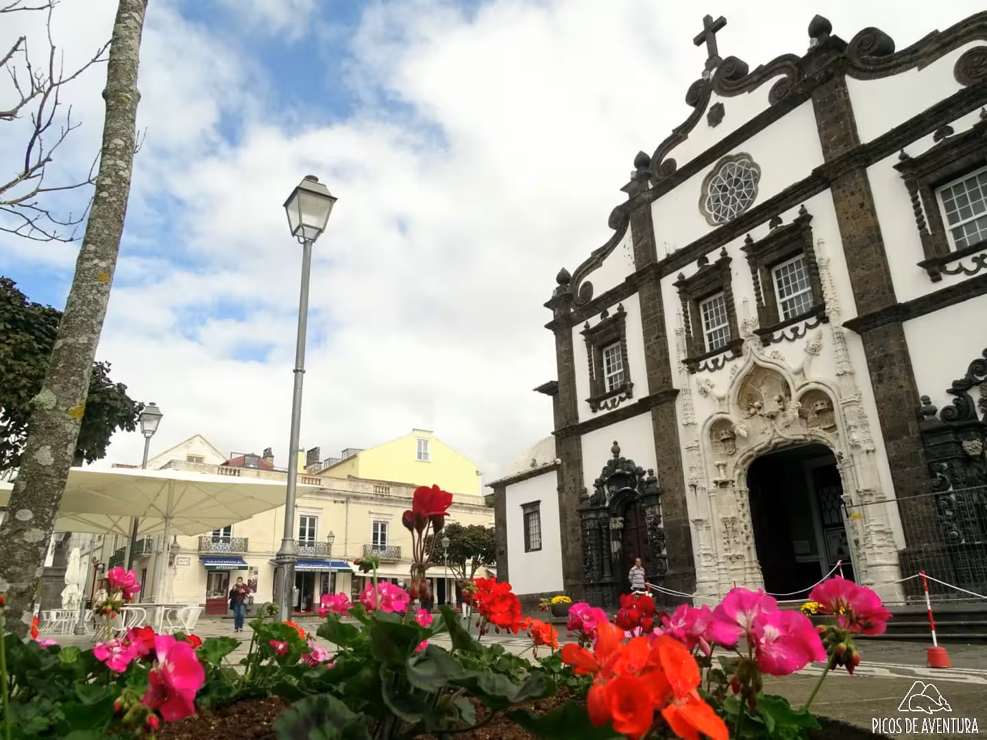 Portas da Cidade church facade and flowerbeds in Ponta Delgada on São Miguel city tour to Ribeira Grande