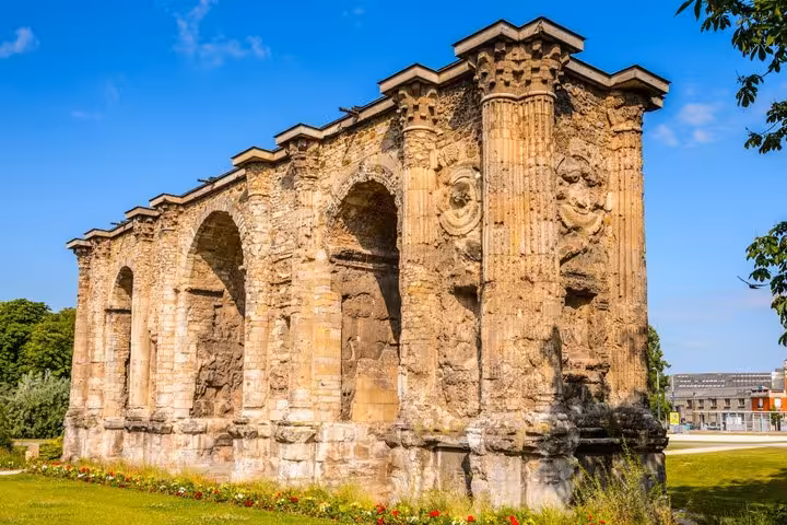 Ancient Roman Porte de Mars triumphal arch with decorative carved columns in Reims, France