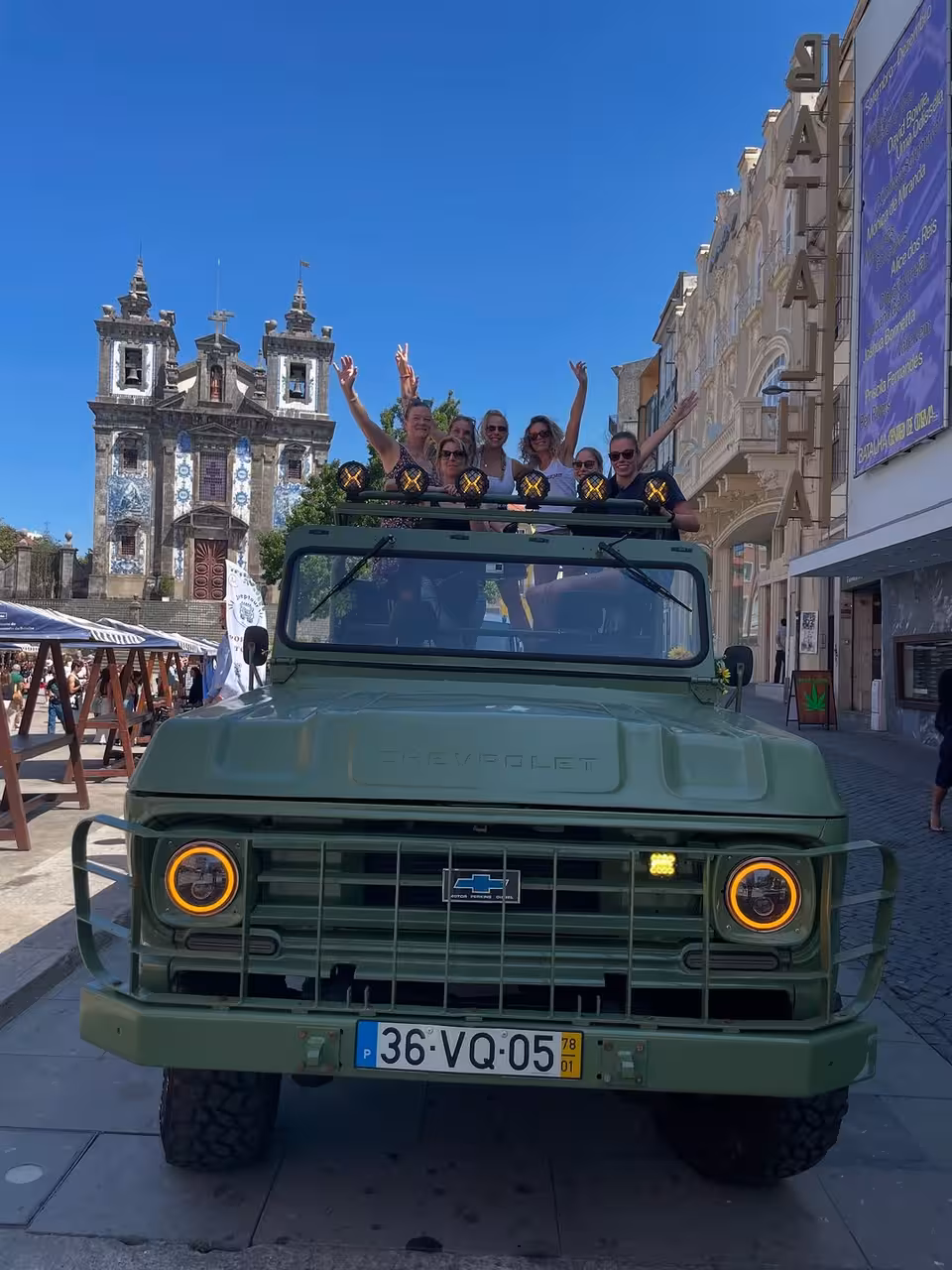 Open-top 4x4 tour in Porto historic center near azulejo church, part of North Coast Adventure experience