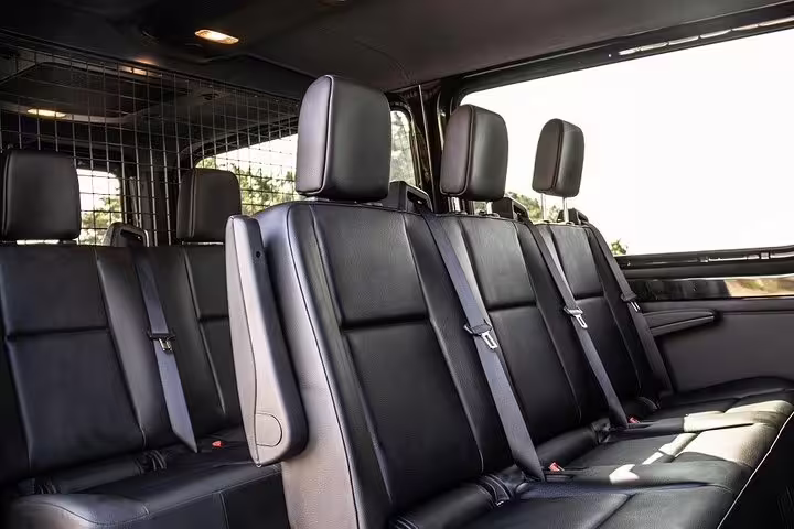 Spacious leather seating in a premium van for Porto Private Airport Arrival Transfer.