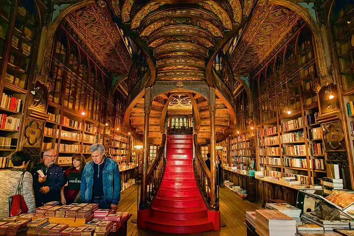 Explore Porto's iconic bookstore with ornate interior during the full-day city tour with wine tasting and cruise.