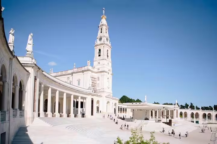 Explore the stunning architecture of the Sanctuary of Fátima on a full-day tour from Porto to Fátima and Coimbra.