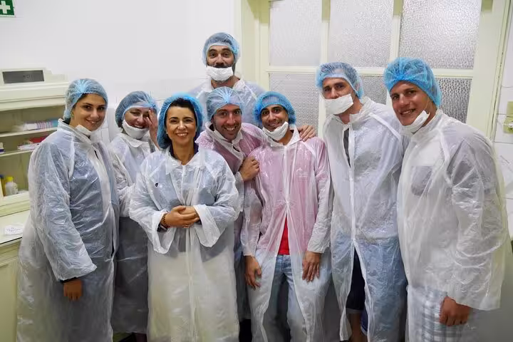 Tour group in protective gear ready for a behind-the-scenes look at Porto's seafood industry.