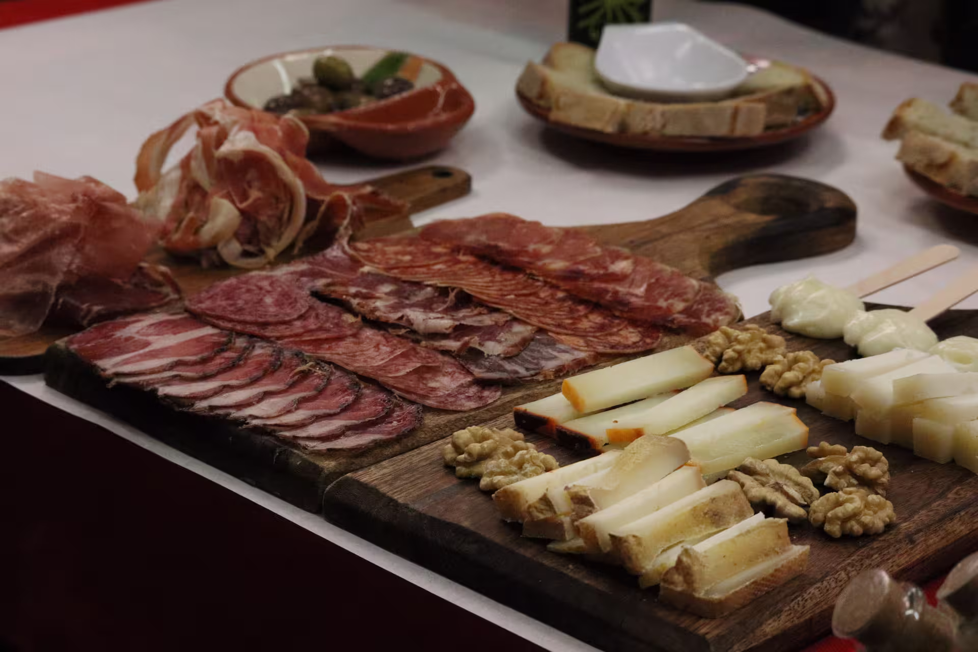 Delicious charcuterie board featuring assorted meats, cheeses, and nuts on a private Porto food tour.
