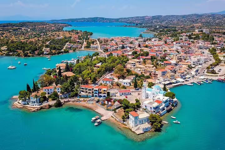 Porto Heli waterfront and turquoise bays near Amanzoe, ideal for private transfer service to Athens