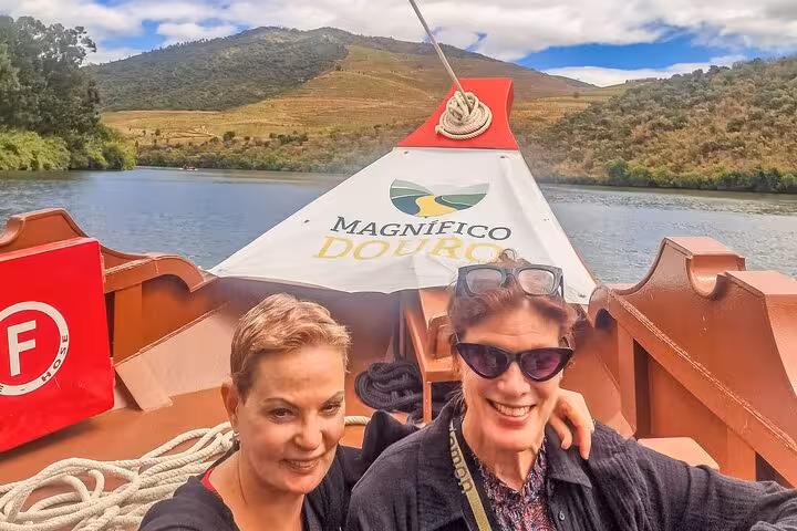 Guests on Magnifico Douro wine boat cruise, Porto to Lisbon transfer with scenic Douro Valley brunch