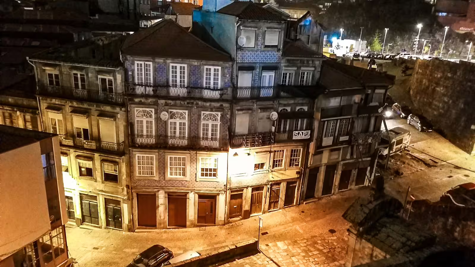 Nighttime view of historic Porto street with traditional Portuguese architecture, ideal for a private night tour exploration.