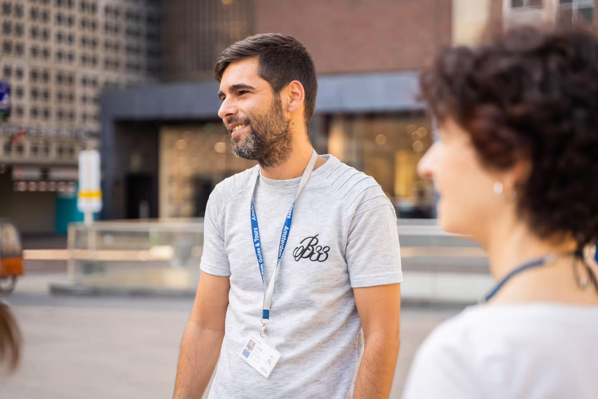 Tour guide interacting with a small group during a scenic Porto old town walking tour and river cruise experience.