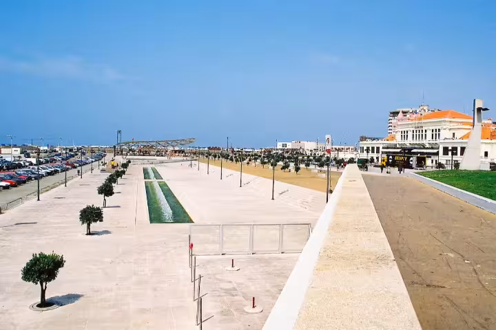 Scenic view of Povoa de Varzim esplanade, a key destination for private car transfer from Porto, showcasing vibrant coastal life.