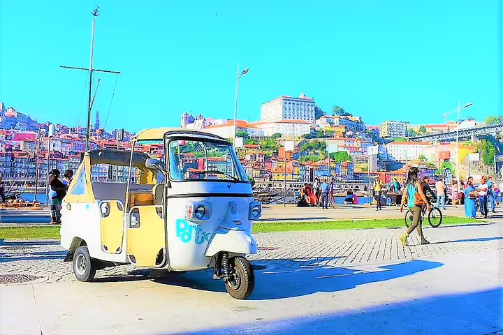 Explore Porto's vibrant streets on a full-day private tuk tuk tour, capturing historic architecture and local culture along the riverfront.