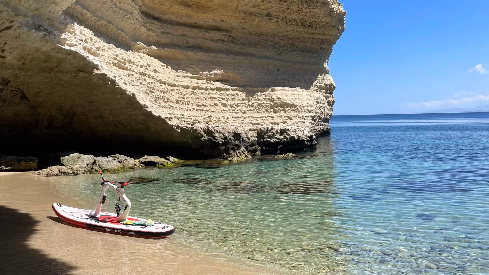 Explore Porto Torres on a water bike amidst stunning rock formations and crystal-clear waters for an unforgettable adventure.