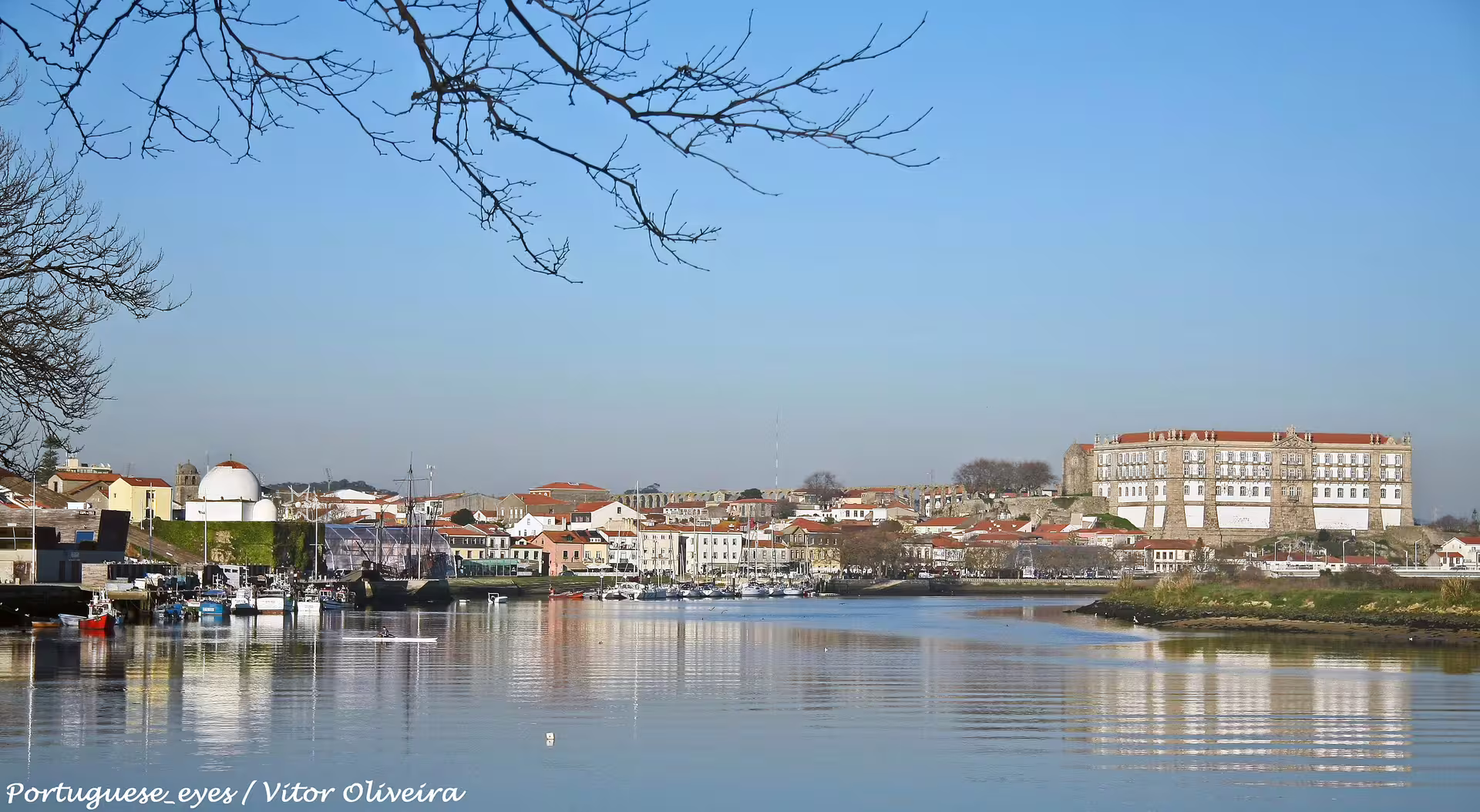 Scenic view of Vila do Conde's waterfront, highlighting a serene destination for private car transfers from Porto.