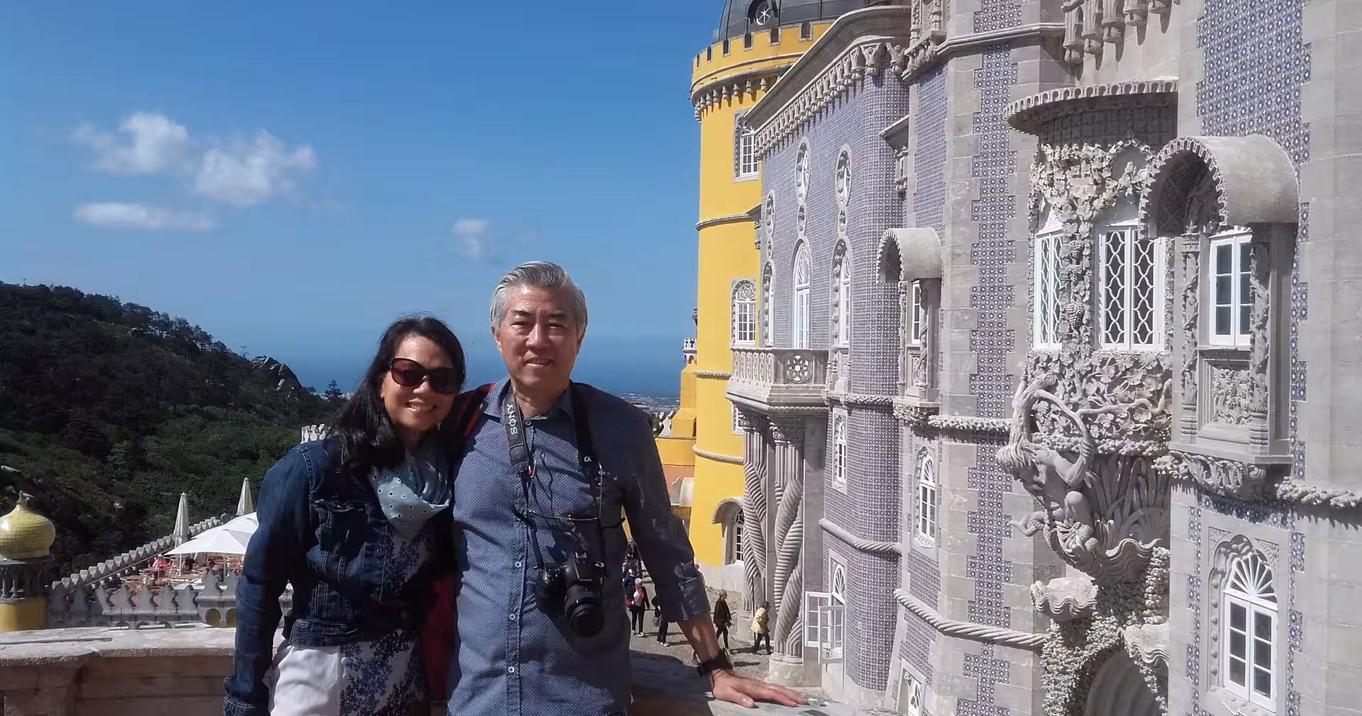 Travelers at Pena Palace, Sintra, on Portugal food and wine tour with day trips and cooking classes
