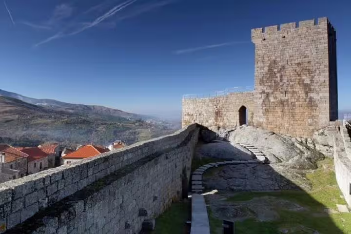 Breathtaking view from an ancient castle tower in Portugal, showcasing stunning landscapes on a historical tour.