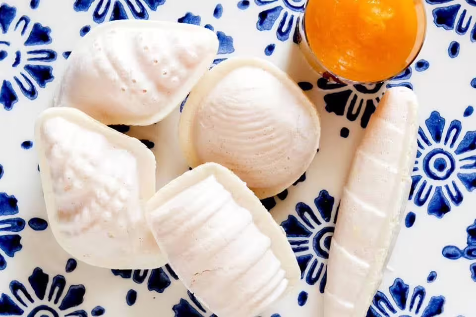 Portuguese convent sweets with a side of orange jam on a traditional blue patterned plate, Lisbon to Porto tour.