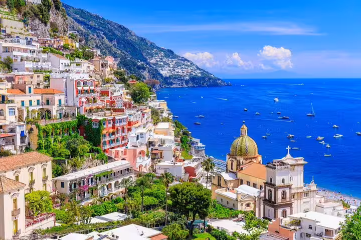 Positano cliffside village and church dome on Amalfi Coast, scenic stop on private day trip from Sorrento