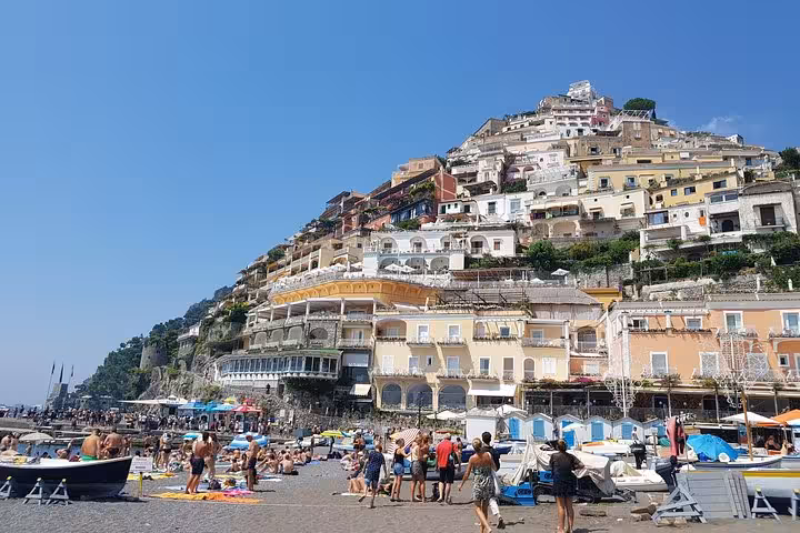 Positano beach and colorful cliffside houses on the Amalfi Coast, stop on 6-day private tour from Rome