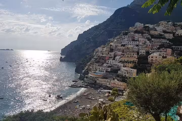 Positano cliffside pastel houses and beach on the Amalfi Coast, highlight of full-day tour from Rome via Sorrento