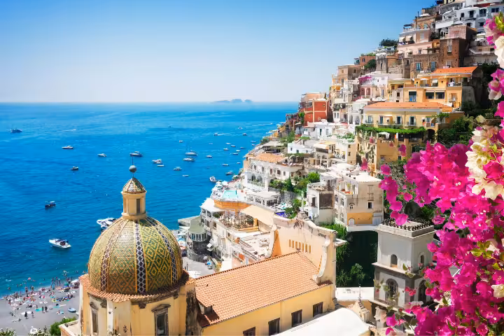 Positano cliffside houses and blue Tyrrhenian Sea view, iconic photo stop on Naples group tour to Amalfi Coast
